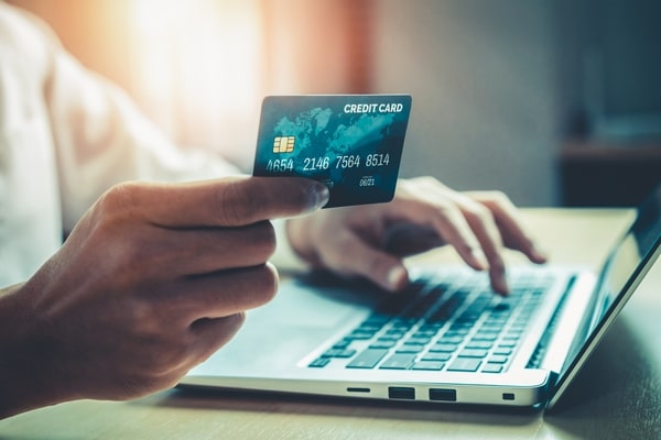 Young man use credit card for online shopping